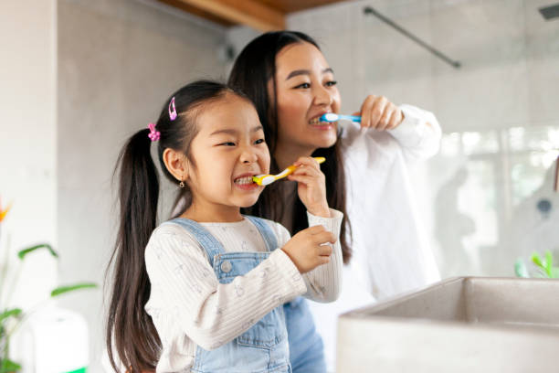 Mother and daughter healthy smile habits